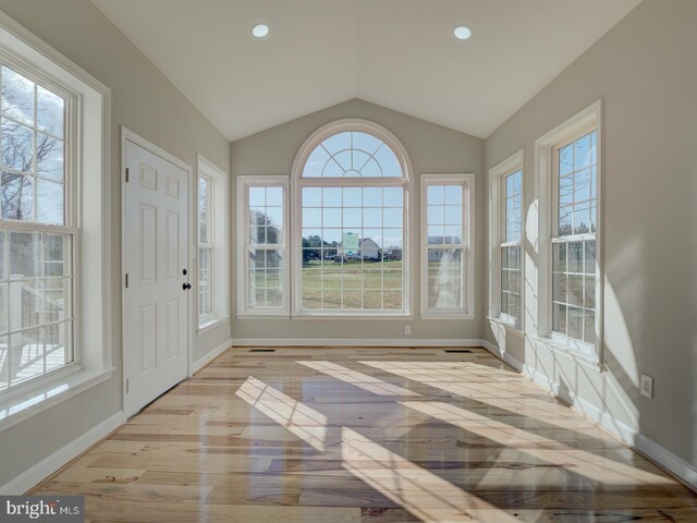 unfurnished sunroom with vaulted ceiling