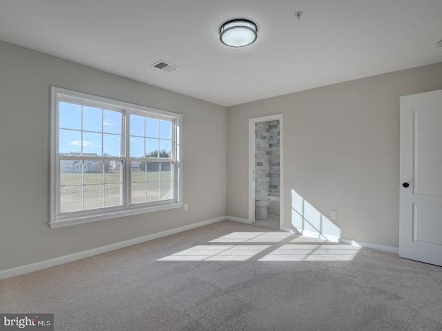 spare room with light colored carpet