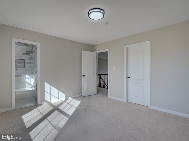 empty room featuring light colored carpet