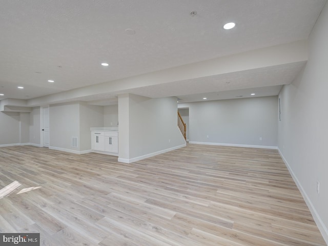 basement with light wood-type flooring