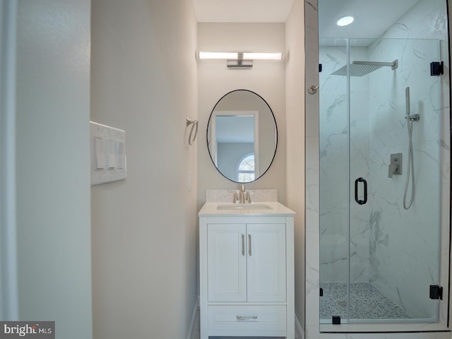 bathroom featuring vanity and an enclosed shower