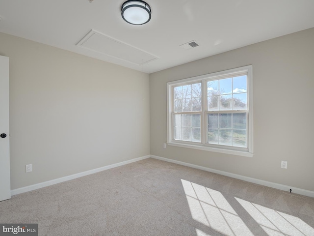 spare room with light colored carpet