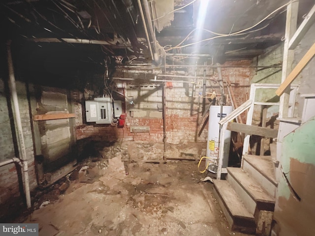 basement featuring gas water heater and electric panel