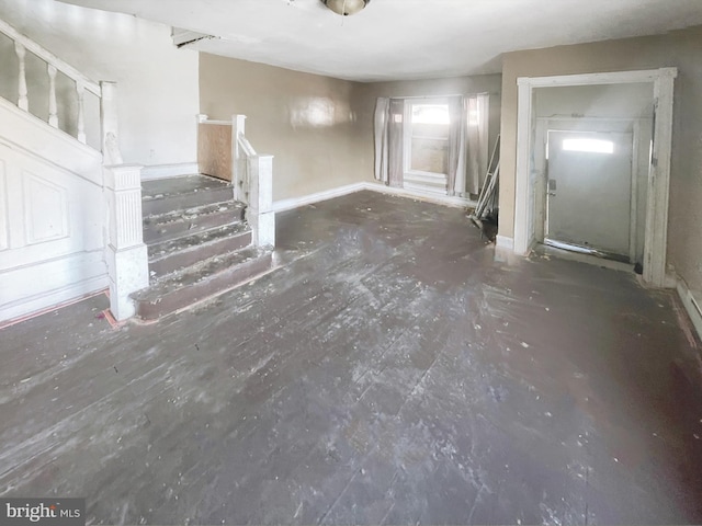 1500 N 56th St, Philadelphia, PA 19131 - unfurnished living room featuring stairway and baseboards