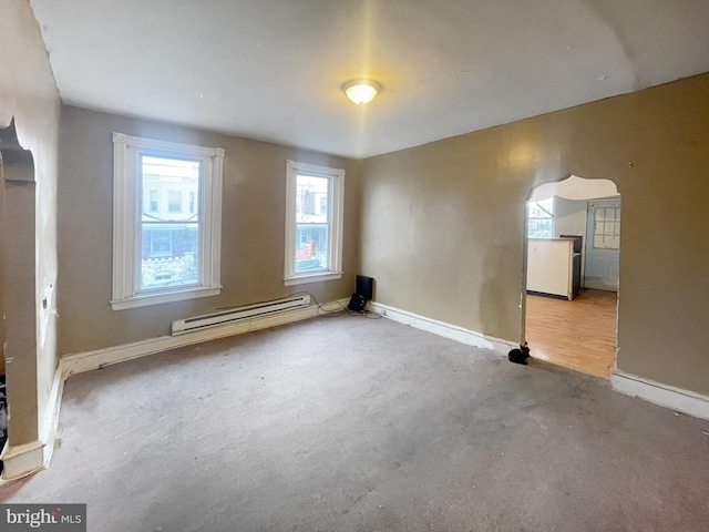 bonus room featuring light hardwood / wood-style floors and baseboard heating