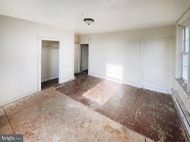 1500 N 56th St, Philadelphia, PA 19131 - unfurnished bedroom featuring a baseboard radiator and a closet