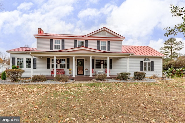 view of front facade with a porch and a front lawn