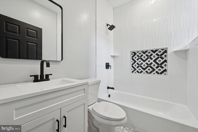 full bathroom featuring vanity, tiled shower / bath combo, and toilet