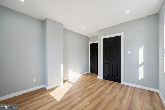 empty room with light wood-type flooring