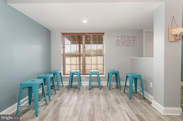 living area with light hardwood / wood-style floors