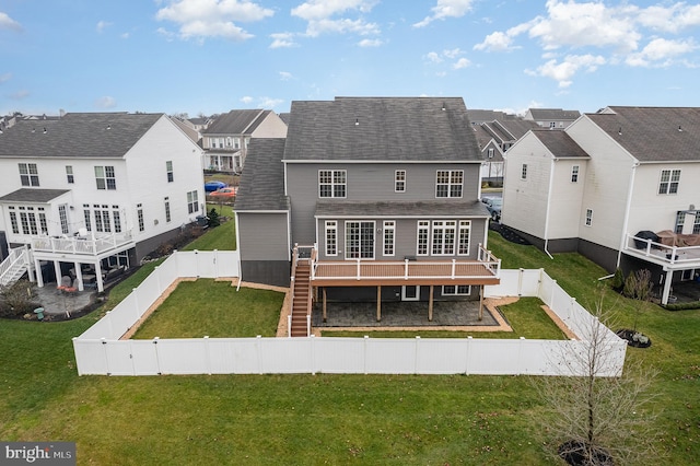 rear view of property with a wooden deck