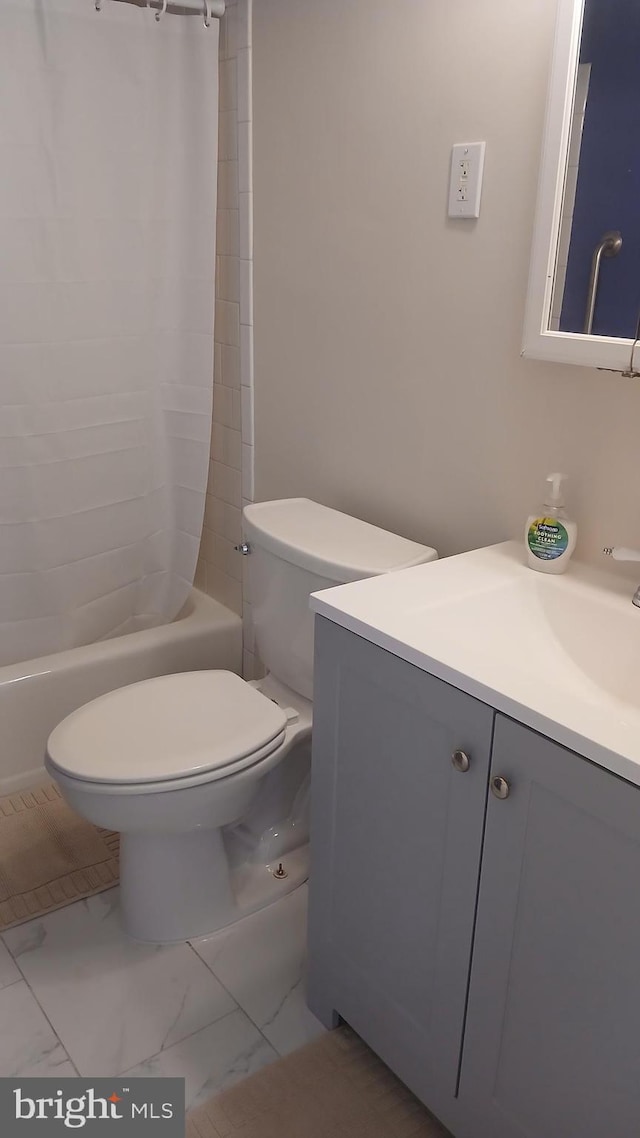 full bathroom featuring shower / tub combo, vanity, and toilet