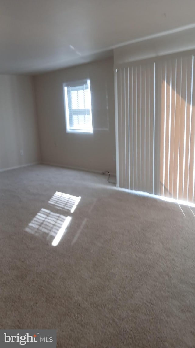 empty room with carpet flooring