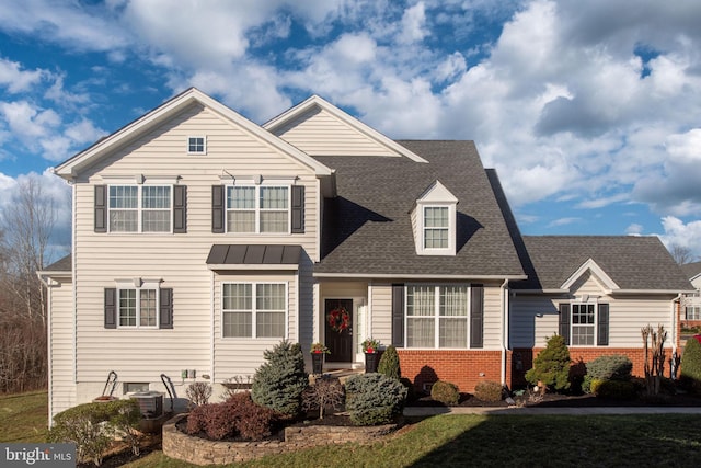 view of front of property with a front lawn