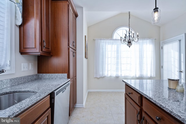 kitchen featuring dishwasher, lofted ceiling, an inviting chandelier, light stone countertops, and decorative light fixtures