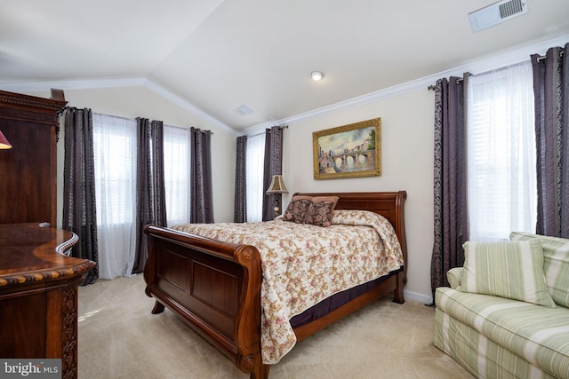 bedroom with multiple windows, light carpet, and vaulted ceiling