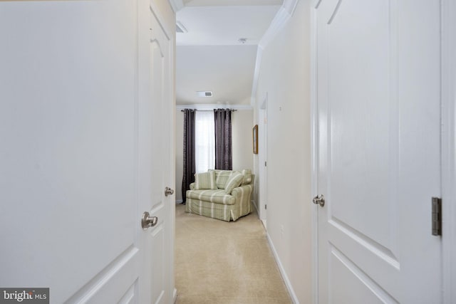 corridor with light colored carpet and ornamental molding