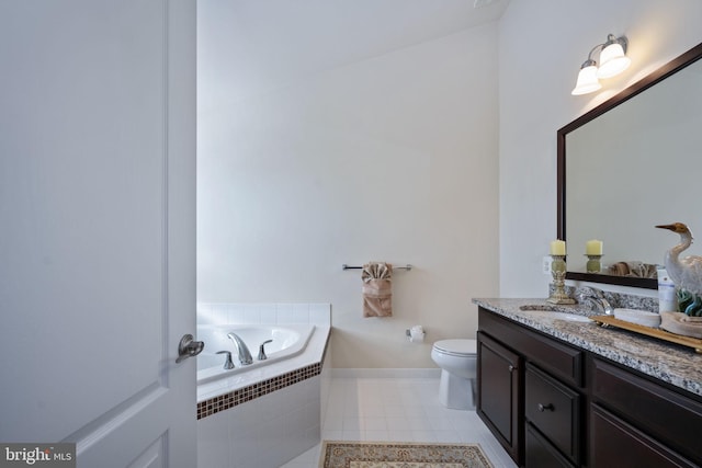 bathroom with tile patterned flooring, vanity, a relaxing tiled tub, and toilet