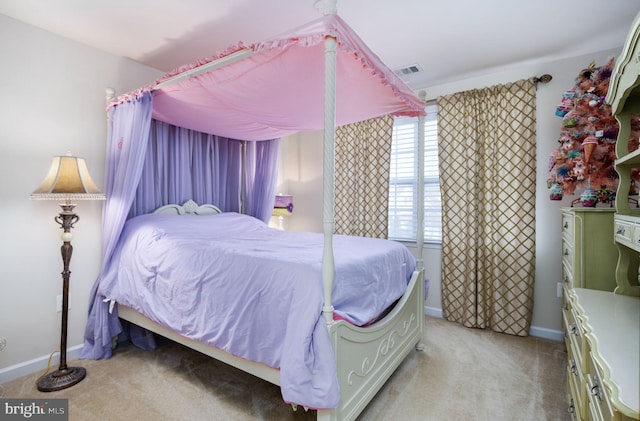 bedroom with light colored carpet