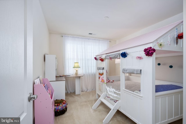 bedroom featuring light colored carpet