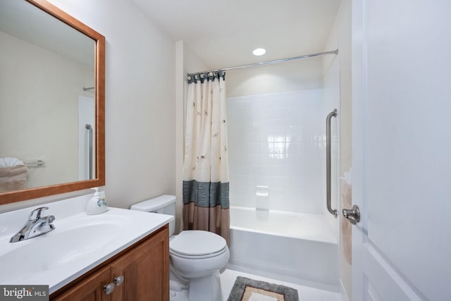 full bathroom featuring shower / bath combo with shower curtain, tile patterned flooring, vanity, and toilet