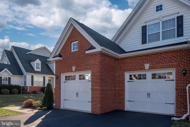 view of side of home with a garage