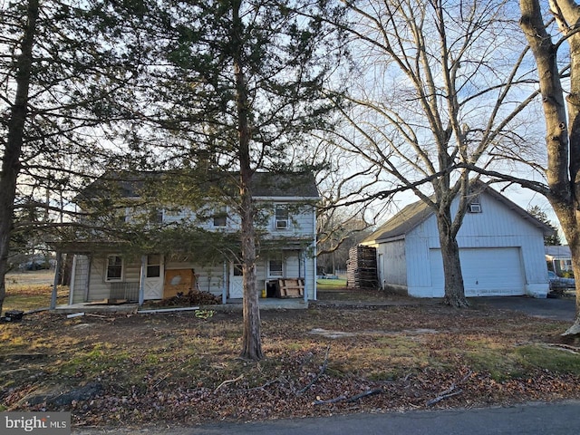 view of front of property featuring a porch and a garage