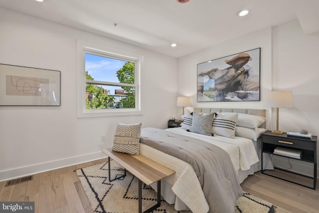 bedroom with light hardwood / wood-style flooring