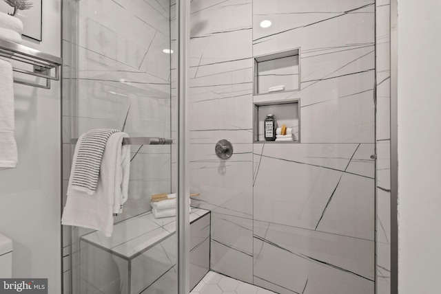 bathroom featuring an enclosed shower