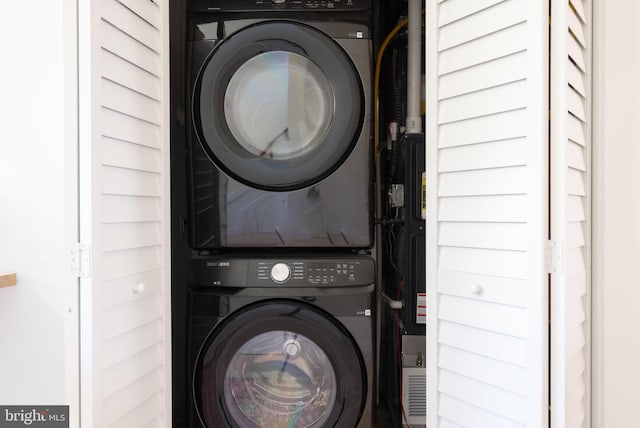 laundry room with stacked washer and dryer