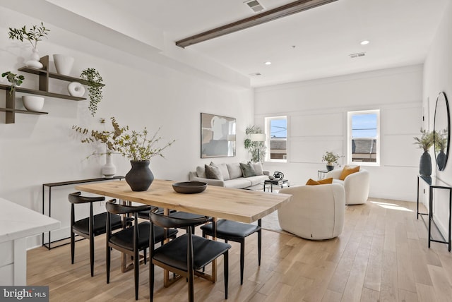 dining space featuring light hardwood / wood-style floors