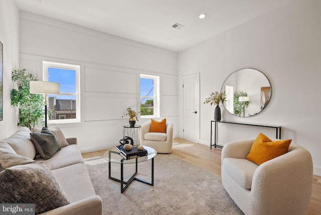 living room with light hardwood / wood-style flooring