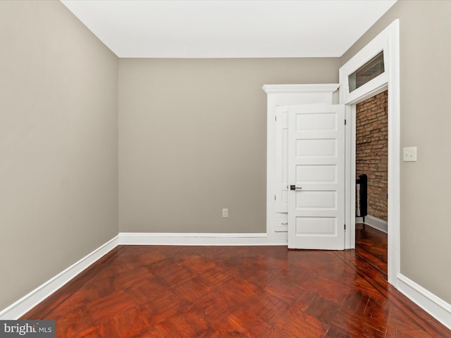 unfurnished bedroom featuring parquet floors