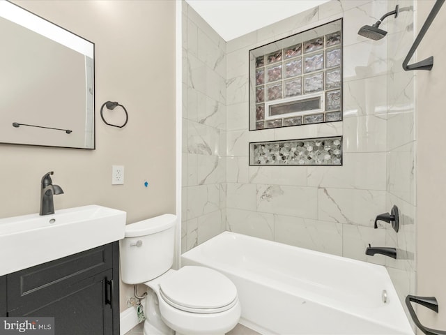 full bathroom featuring tiled shower / bath combo, toilet, and vanity