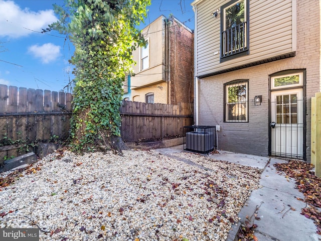 view of yard featuring a patio area and central AC unit