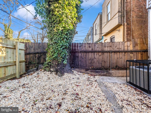 view of yard featuring central AC