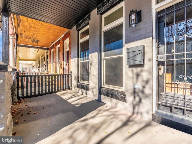 310 E 25th St, Baltimore, MD 21218 - property entrance with a porch