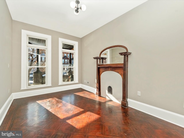 interior space featuring dark parquet floors and lofted ceiling