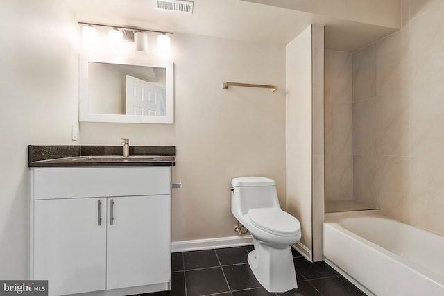 full bathroom with tile patterned flooring, vanity, tiled shower / bath combo, and toilet