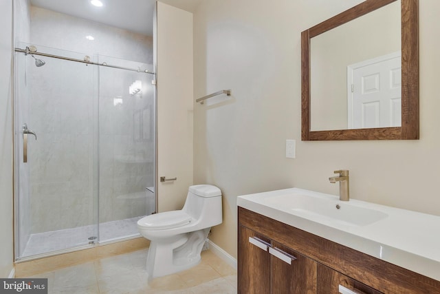 bathroom featuring tile patterned flooring, a shower with door, vanity, and toilet