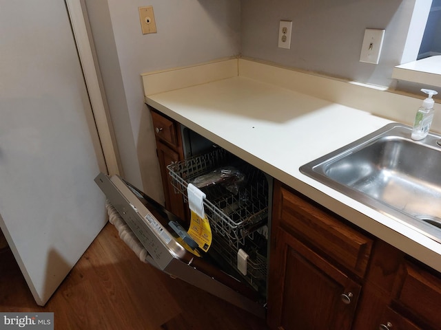 kitchen with sink and dark hardwood / wood-style flooring