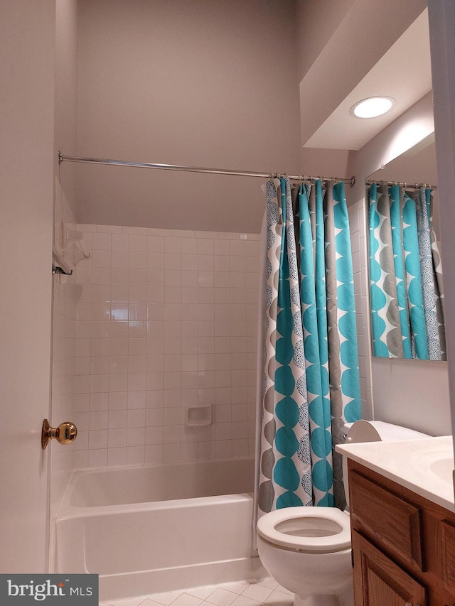 full bathroom featuring tile patterned floors, toilet, vanity, and shower / tub combo