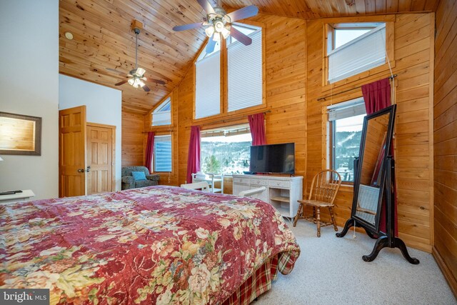 carpeted bedroom with wood walls, wooden ceiling, high vaulted ceiling, a baseboard heating unit, and ceiling fan