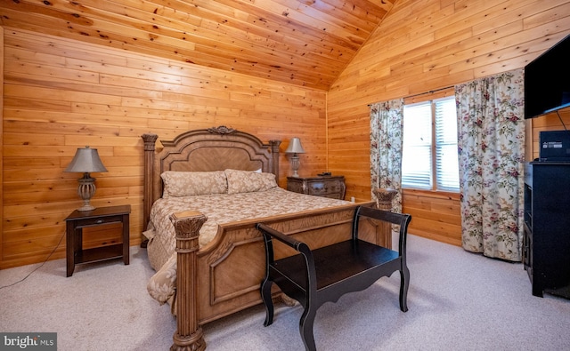 carpeted bedroom with wood walls, wood ceiling, and high vaulted ceiling