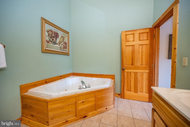 bathroom featuring tile patterned floors, a bathtub, and vanity