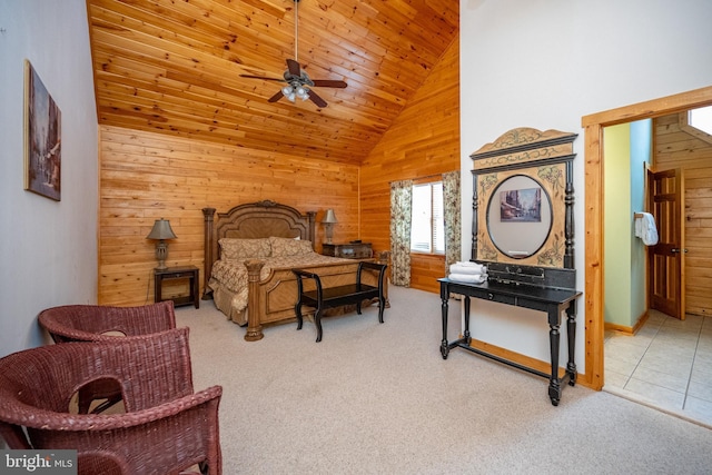 carpeted bedroom with wood walls, high vaulted ceiling, and wooden ceiling