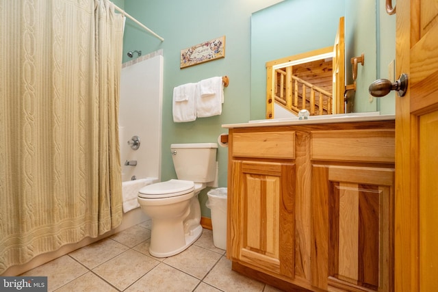 full bathroom featuring tile patterned floors, shower / tub combo with curtain, vanity, and toilet