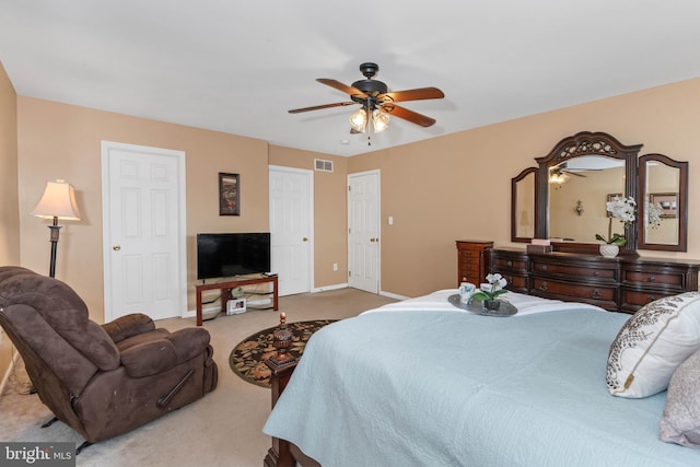 carpeted bedroom with ceiling fan