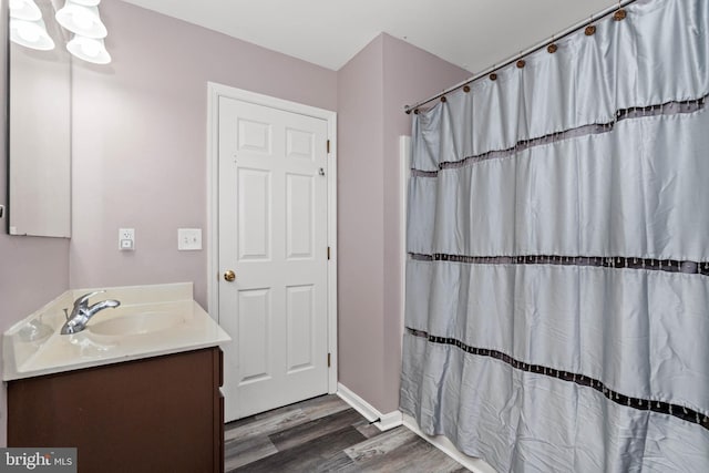 bathroom featuring a shower with curtain, vanity, and hardwood / wood-style flooring