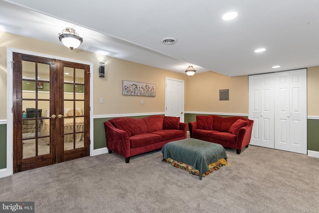 living room featuring french doors and carpet floors